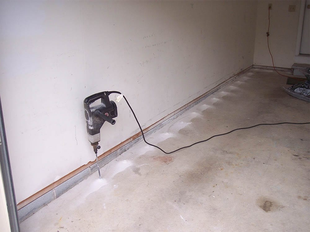 Pest control technician working at a residential home